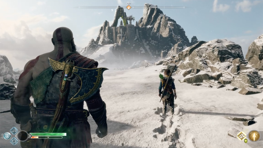 kratos and atreus walk the snow summit of a mountain