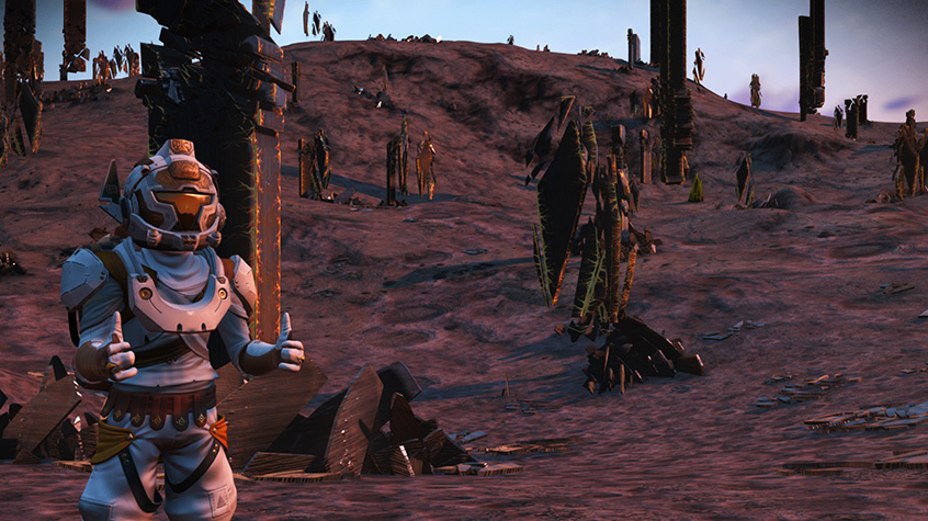 Player poses with two thumbs up on an exotic planet from No Man's Sky